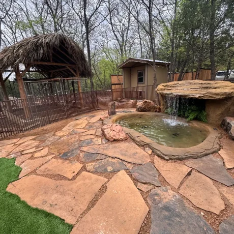 A luxurious hot tub surrounded by lush landscaping, perfect for relaxing after a day of resort activities at Oak Meadow Ranh RV in Valley View, TX.